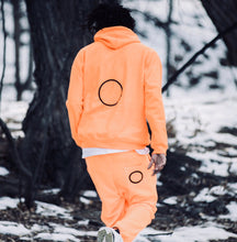 orange “Unite” Jump Suit