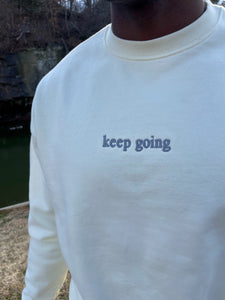 cream “keep going” crew neck sweatshirt