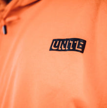 orange “Unite” Jump Suit