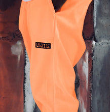 orange “Unite” Jump Suit