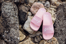 “keep going” slides pink