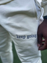 cream “keep going” sweat pants